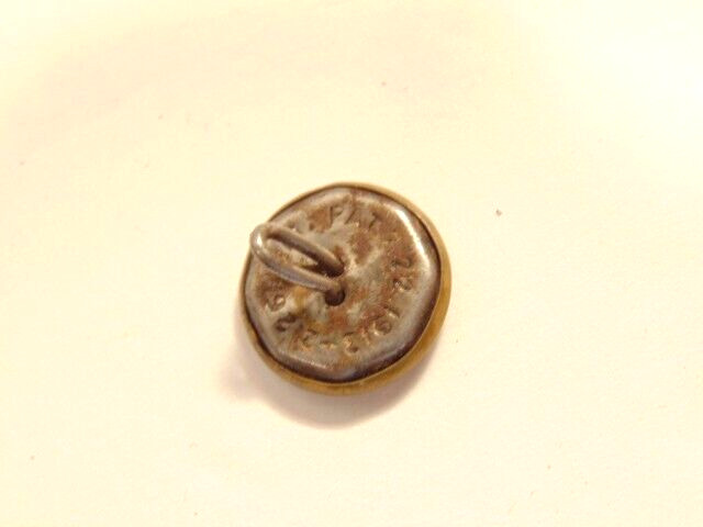 older brass colored “R.H. & Co.” button with 1913 and 1918 patent date on back