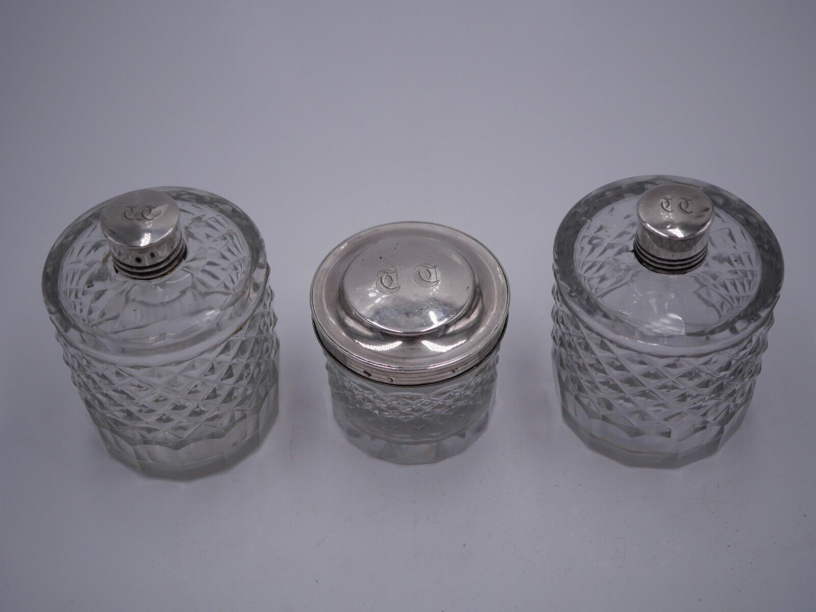 PAIR OF SOLID SILVER BOTTLES AND BOX WITH OLD HALLMARK 1819 AND CRYSTAL