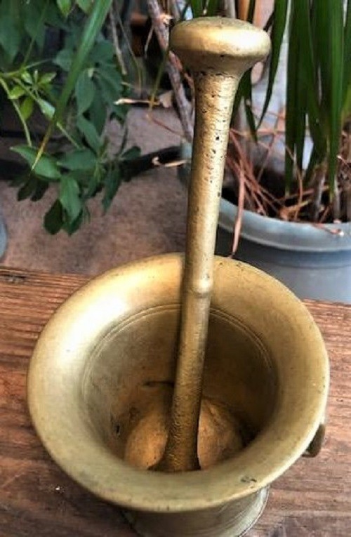 Early solid brass mortar and pestle