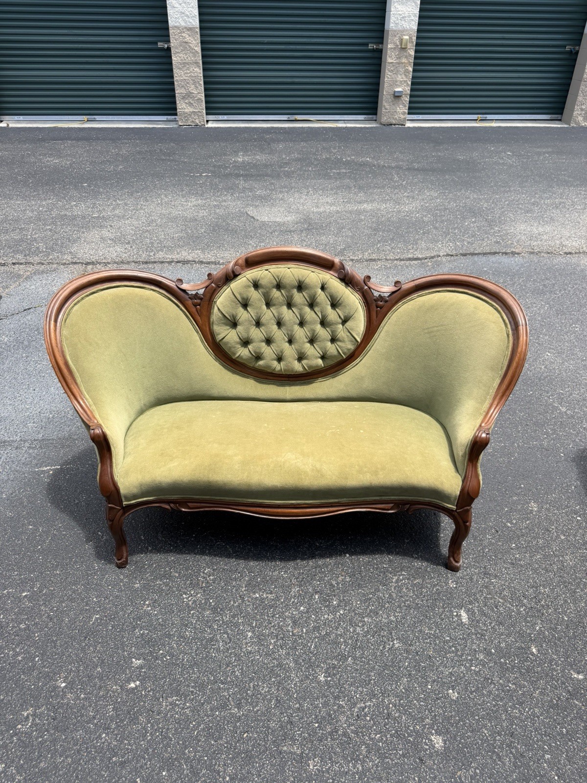 Antique Victorian settee with Green Velvet Upholstery & Carved Wooden Back