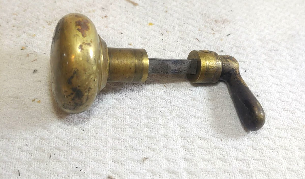 vintage door knob small round on one end and L shaped on the other